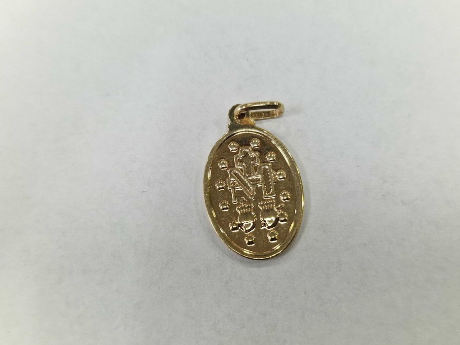 Złoty wisiorek/ medalik/ 585/ 1.39 gram/ nowoczesny