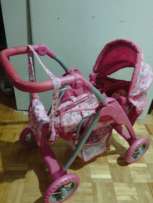Różowy wózek dla lalek