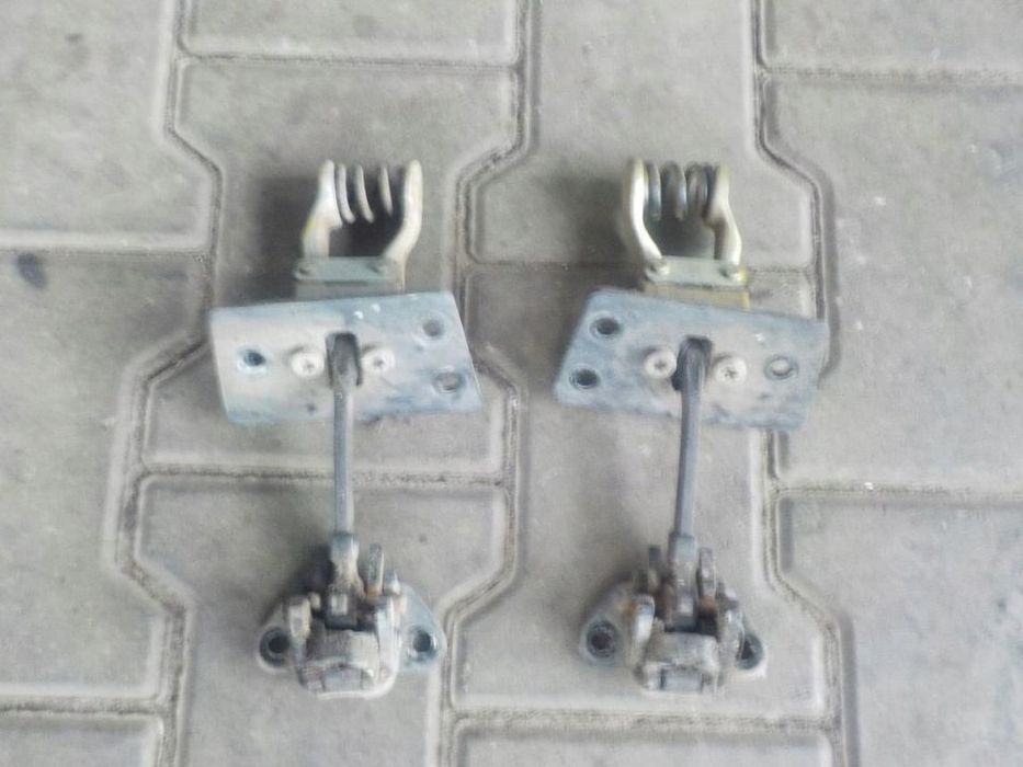 VW T5 T6 OGRANICZNIK DRZWI TYŁ PRAWY  LEWY