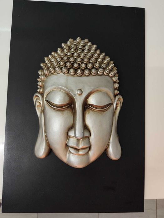 Quadros de Buda em relevo.