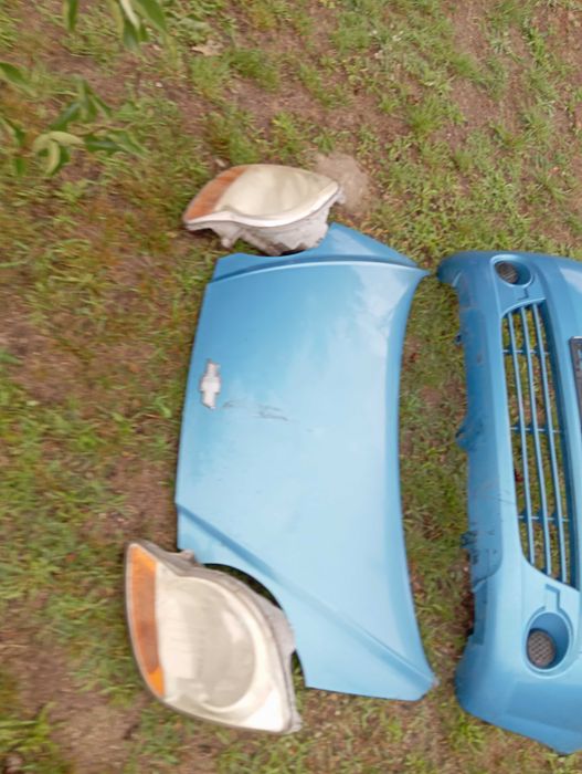 Chevrolet Matiz maska zderzak lampy