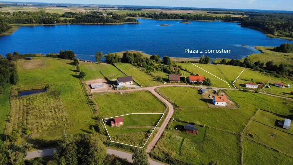 Działka nad jeziorem Dybowskim z dostępem do linii brzegowej z domkiem.