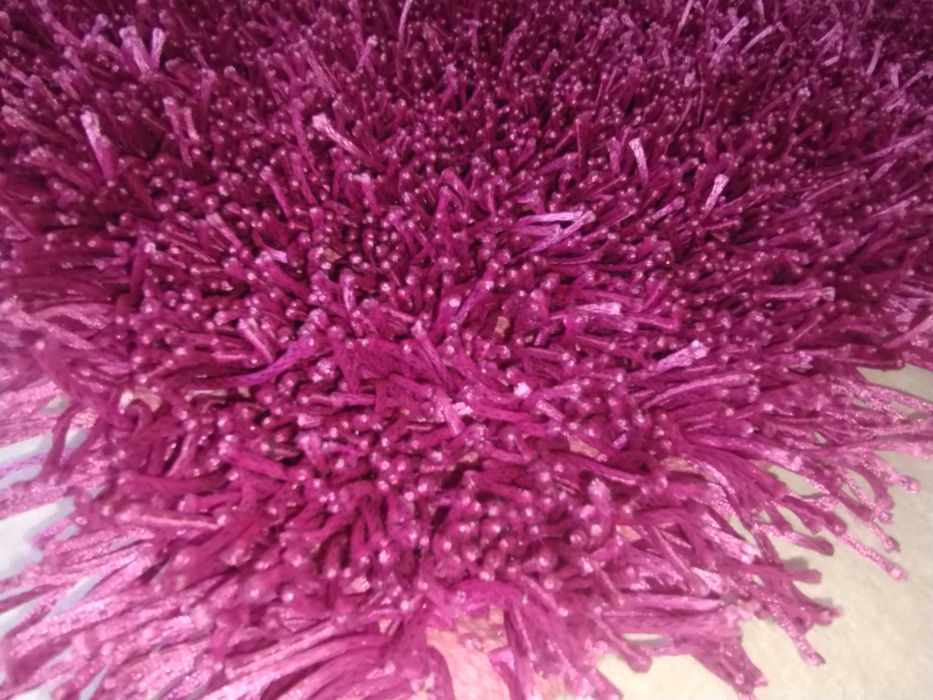 Long-pile magenta rugs. New