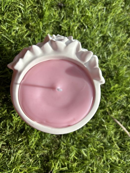 boneca de gesso cerâmico com vela