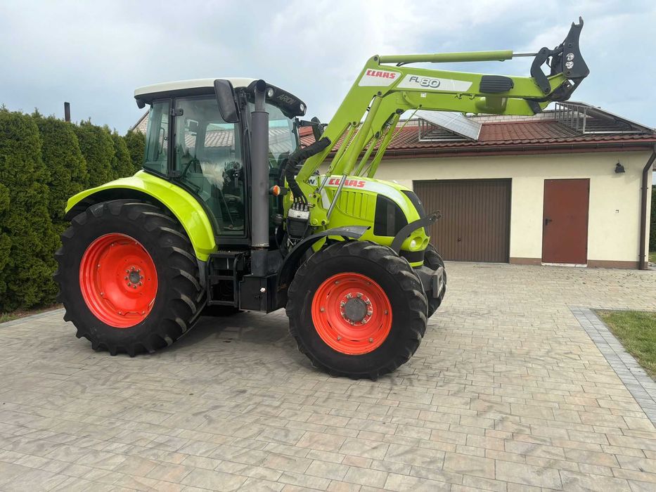 Claas Arion 510 z ładowaczem