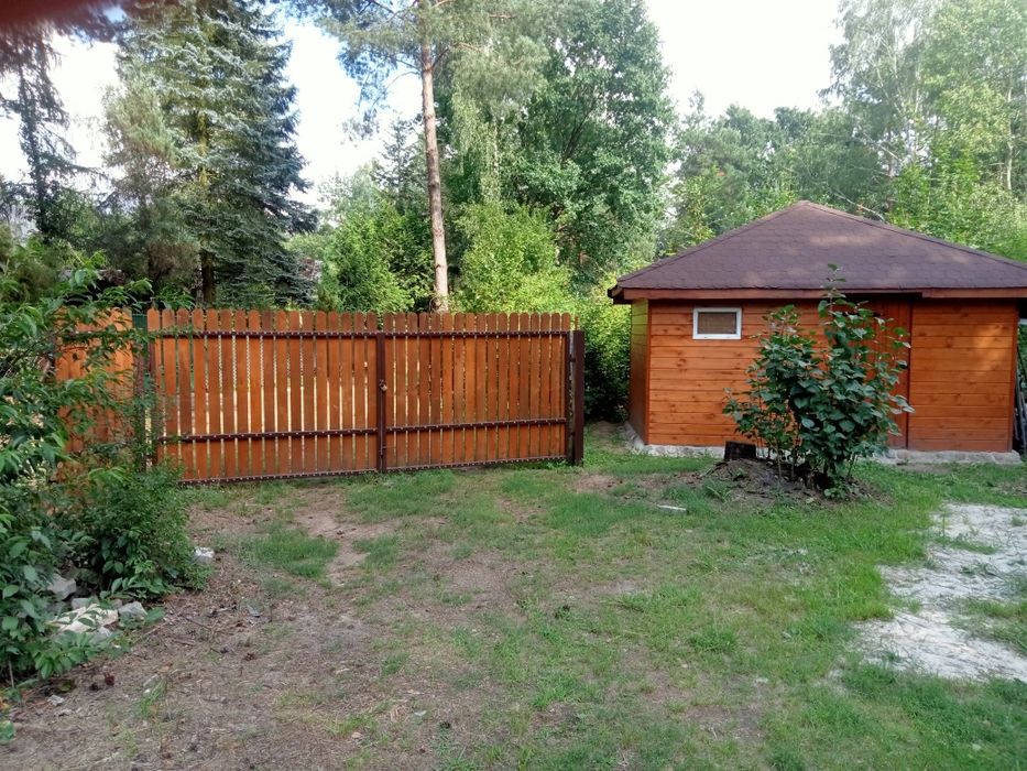 Sprzedam działkę z nowym całorocznym domkiem