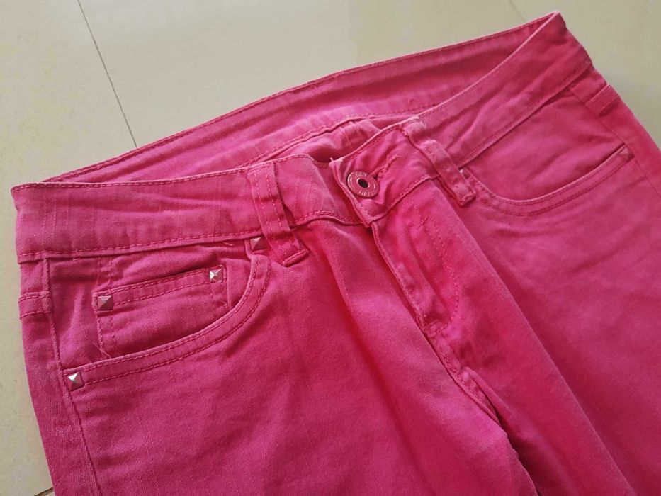 Różowe dżinsy spodnie damskie dopasowane biodrówki rurki L Reals Jeans