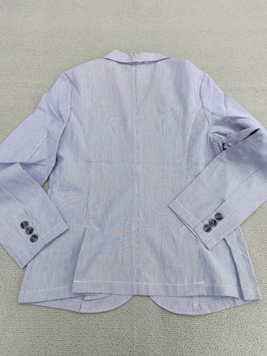 Піджаки, жилетки, кофтинки, гортайте фото