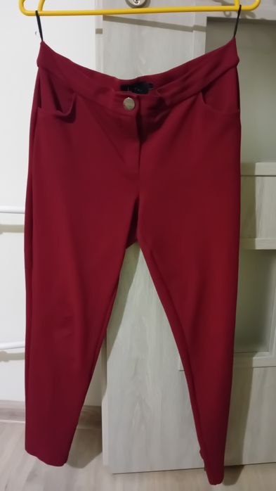 Spodnie eleganckie z kieszeniami ozdobnymi zameczkami i kokardami