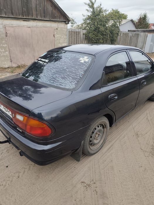 Mazda 323 1998 год