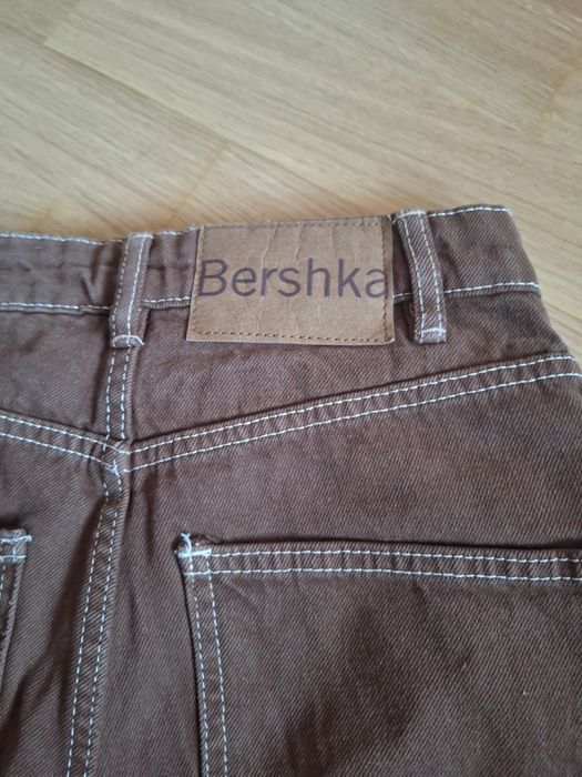 Damskie jeansy dzwony Bershka 32