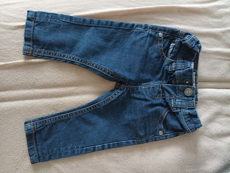 Spodnie 6-9 miesięcy next jeansy