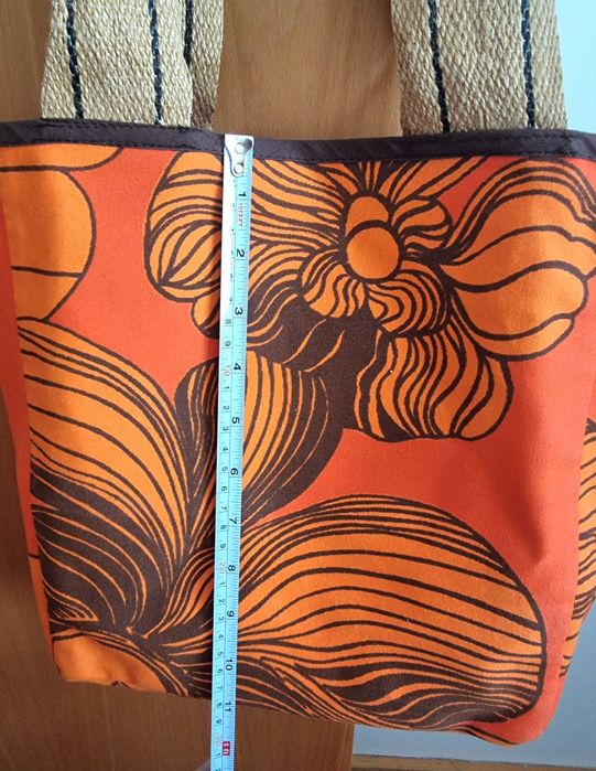 Mala/ saco laranja e castanho com padrão florido
