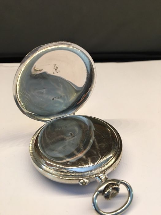 Relógio de bolso marca Merville em prata