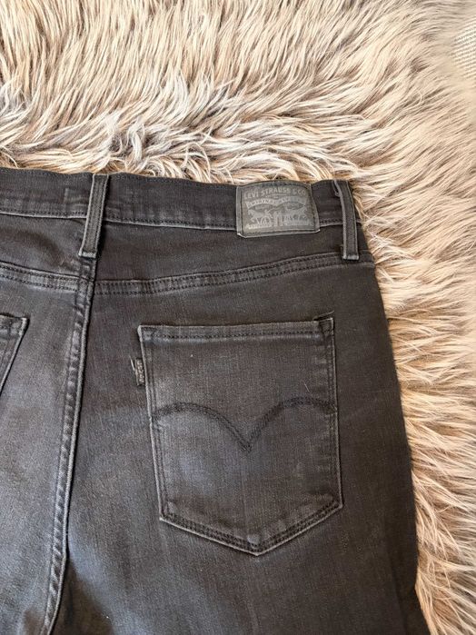 Jeansy Levi's 720 High Rise Super Skinny W31 czarne przetarcia dziury