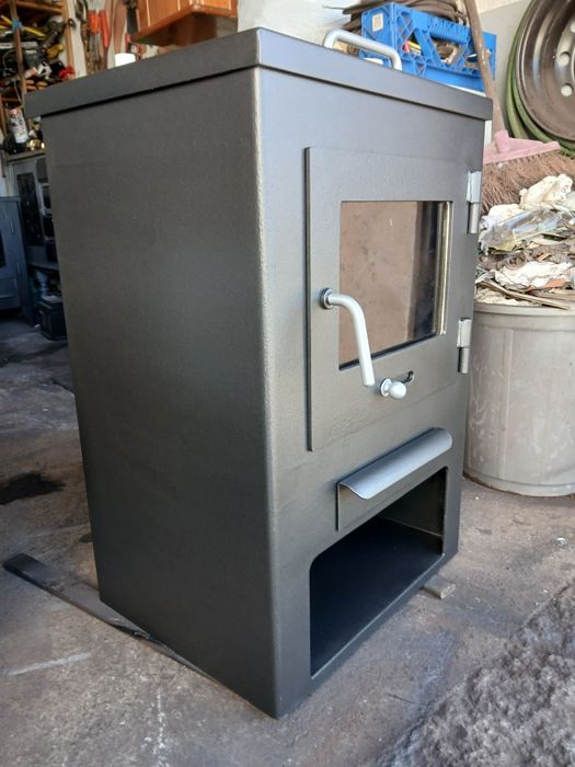 Vendo salamandra a lenha com tampo que abre para cozinhar.  Como nova.