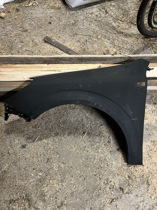 lewy błotnik w podkladzie Opel Astra H