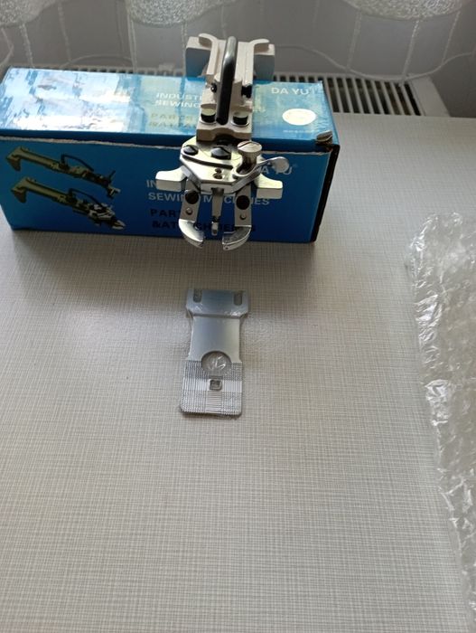 Лапка до пришивання гудзиків