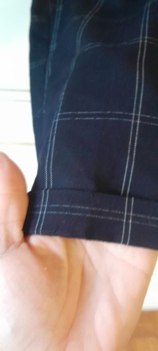 Calças de tecido com bolsos slim fit