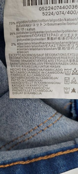 Bawełniane granatowe spodnie jeansowe BERSHKA, R. 36