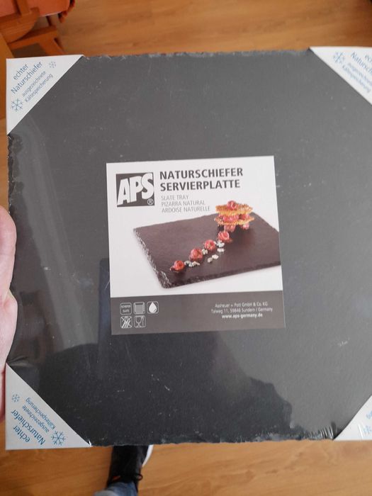 Tábuas de ardósia de marca alemã para servir comida.