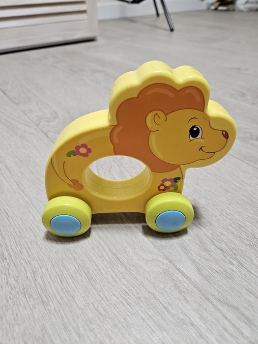 Каталка лев машинка