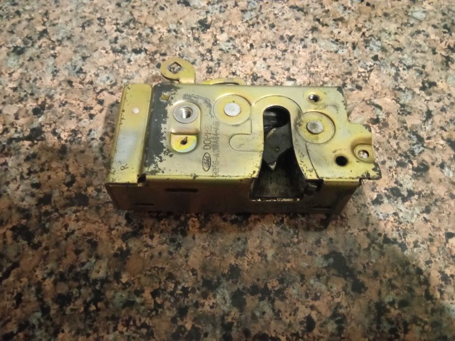 Замок передній правий дверки 96FG-A219A64-AB Фієста Кур’єр Мк4 Dopre