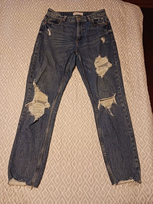 Calças de ganga rasgadas
