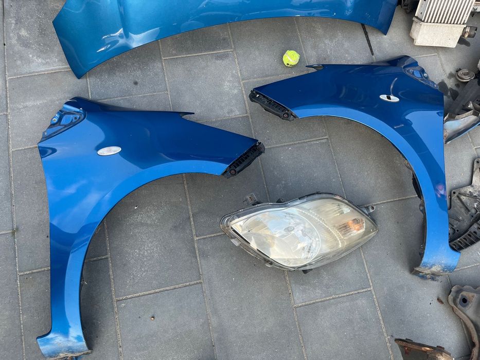 Toyota Yaris II maska błotnik pas przedni  8T7 chłodnice 1.4 d4d