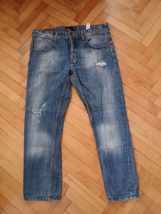 Spodnie jeans męskie z przetarciami  New Yorker  34