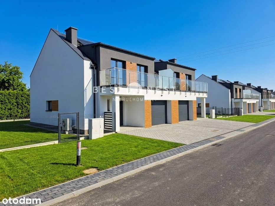 Nowoczesny dom z garażem w zabudowie bliźniaczej