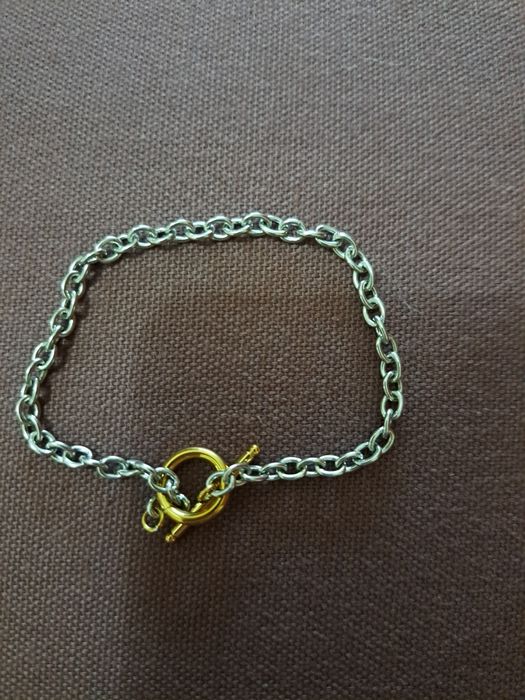 Pulseira em aço prateado e dourado