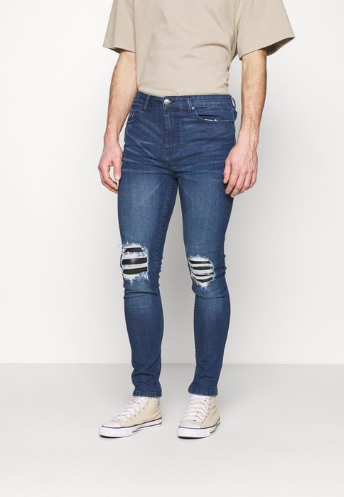 Jeansy z dziurami 274 34