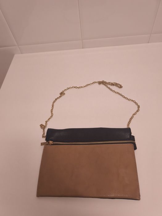 Mala tiracolo preta e bege