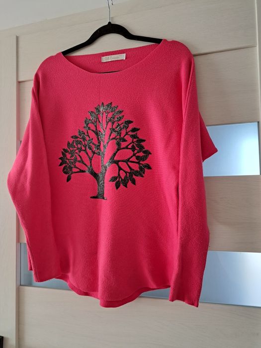 Sweter damski różowy.