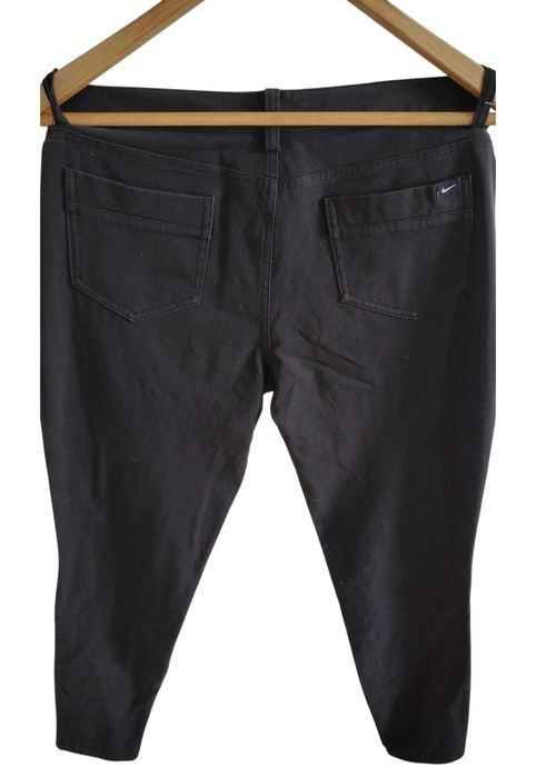 Markowe elastyczne spodnie jeans firmy Nike r 38 M czarne