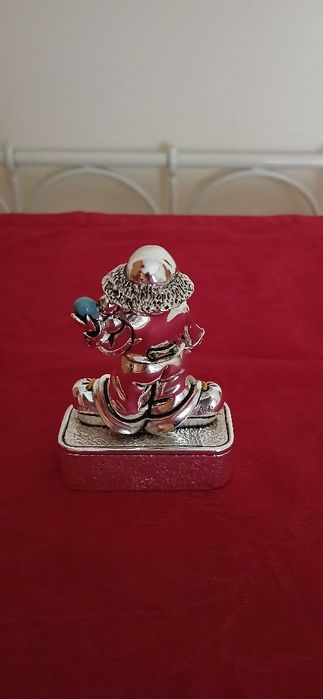 Palhaço de prata laminada com afia-lápis