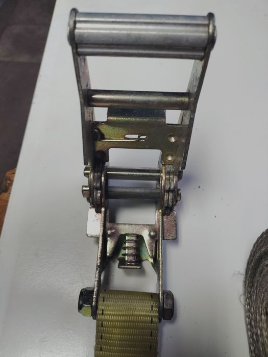 Pas transportowy mocujący