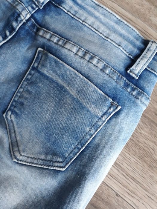 Spodnie jeansowe damskie z niskim stanem z rozdarciami z dziurami r. S