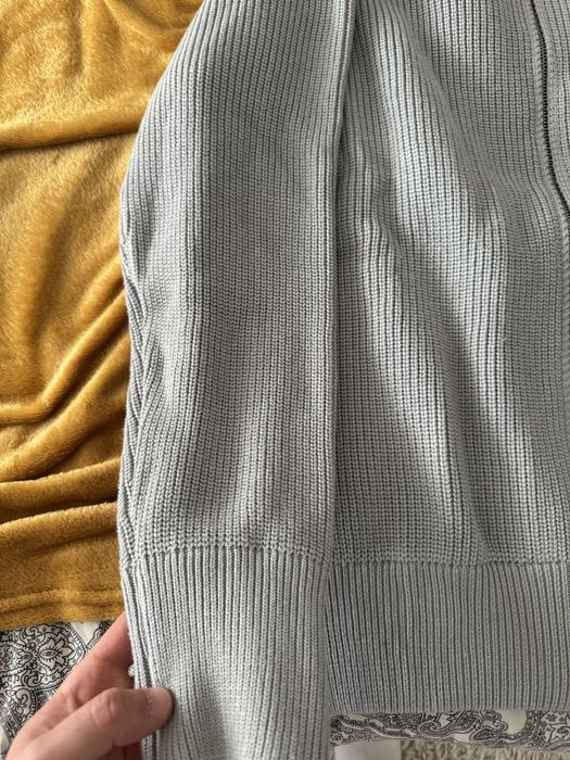 Cardigan de malha com fecho da Maison Margiela.