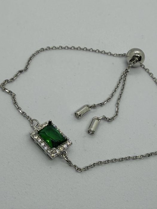 Bransoletka ściągana z zielonym oczkiem sygn Swarovski