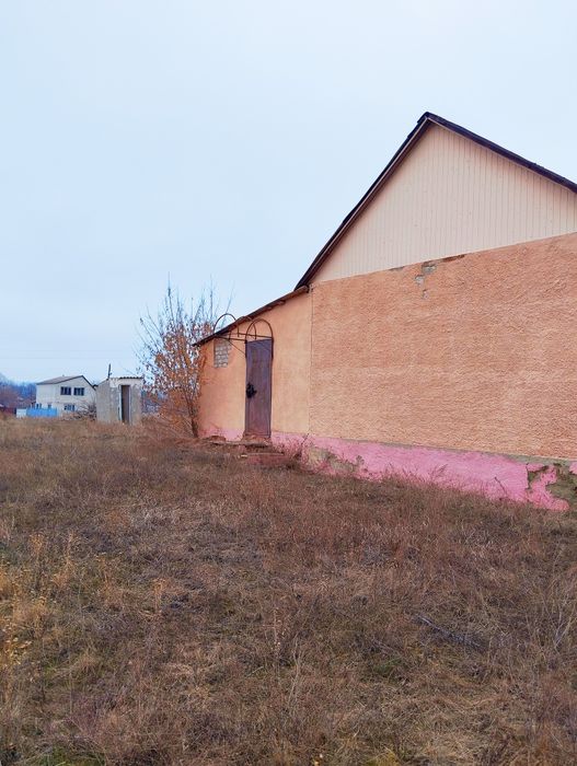 Продам дом можно и под  магазин  Нововодолажский район  Вільхуватка.
