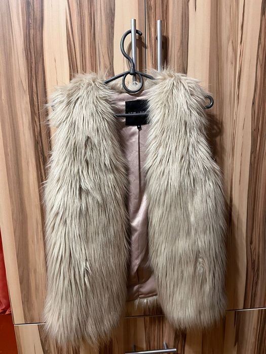 Продам теплу желетку