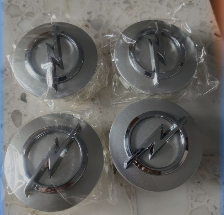 4x NOWE dekielki  DO oryginalnych FELG OPLA 54mm. Montażowa średnica 46-48mm . Emblematy logo opla do felga aluminiowych