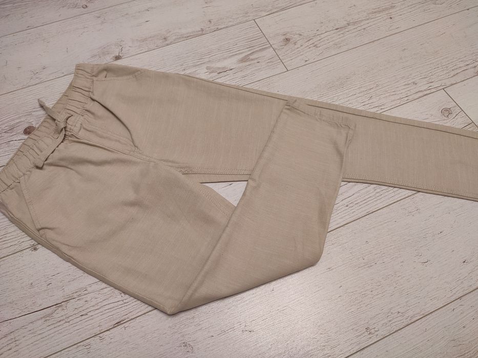 Bawełniane eleganckie spodnie rozmiar 140