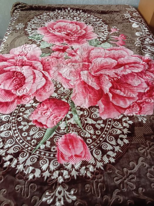 Ковдра або плед тепле