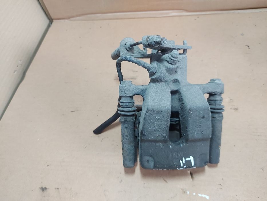 / Megane III 3 zacisk hamulcowy lewy tył