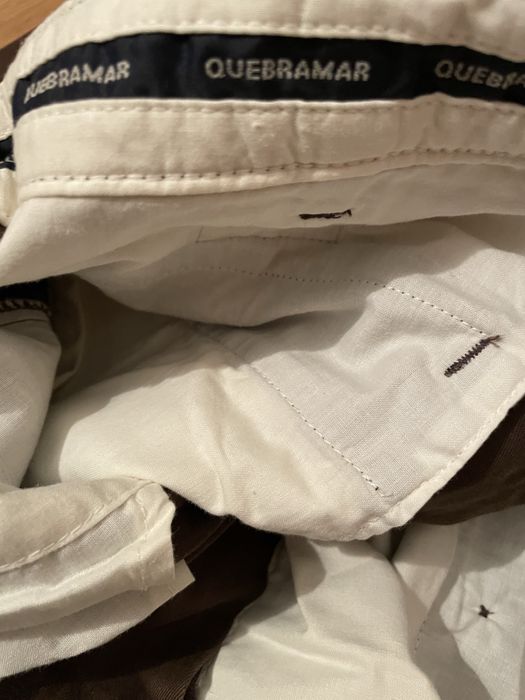 Calças castanhas quebramar