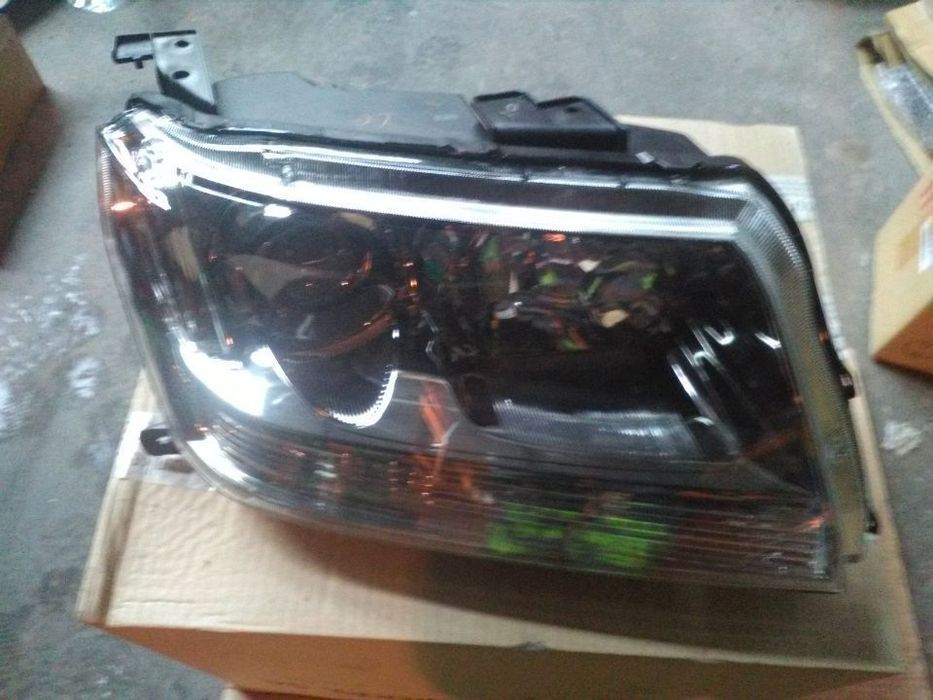 Farol frente grand vitara 2006  novo