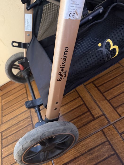 Carrinho bebé cor preto e dourado 3em 1 em muito bom estado